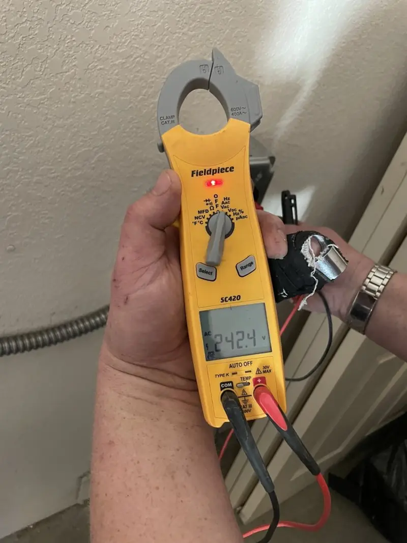 Voltage testing with clamp meter during Ceiling Fan Installation in Sherwood